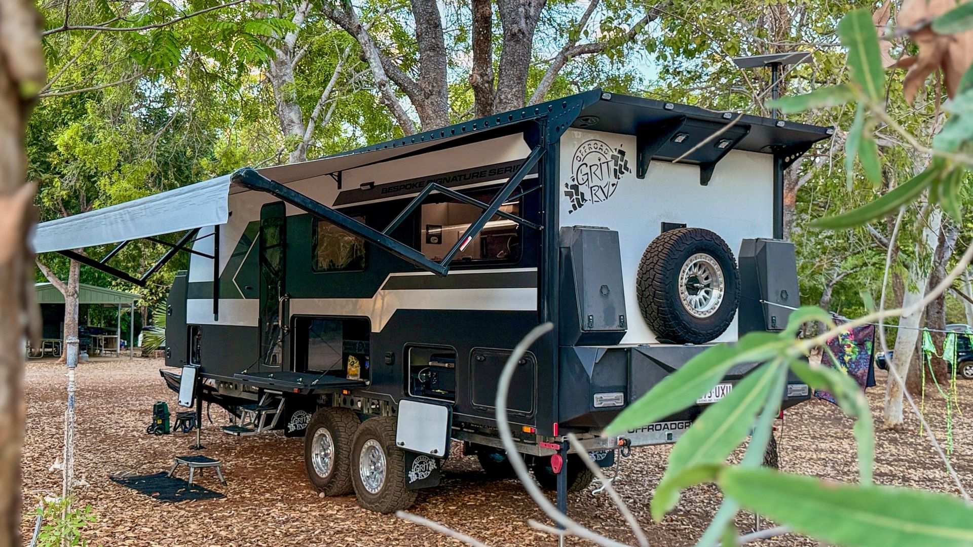 Rear of the 23 foot 6 build for Aussie Destinations Unknown among trees