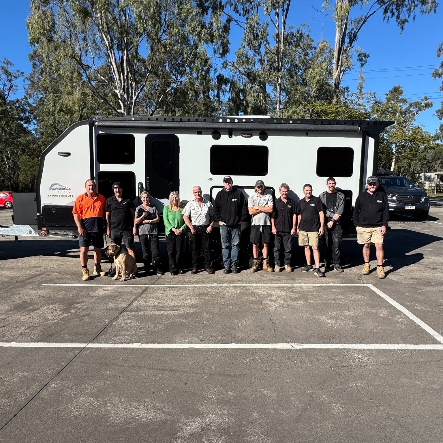 The Offroad Grit RV team in front of a finished van