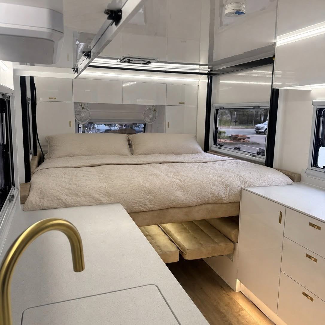 Gold tap and the bed beyond