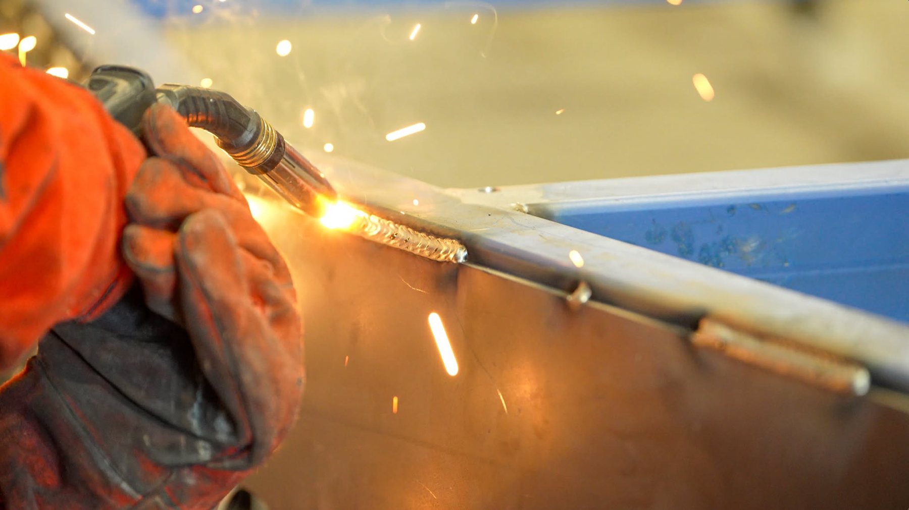 A weld being laid on a chassis join