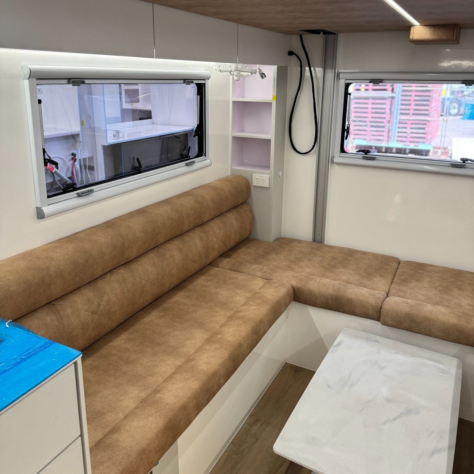 Tan rear lounge with shower beyond