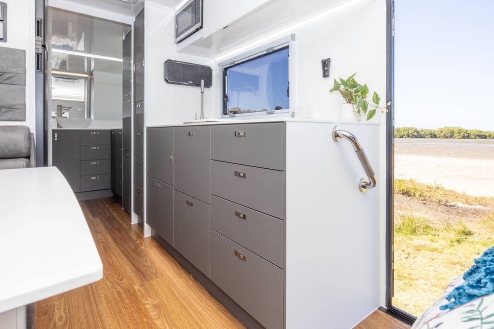 Grey cabinetry, timber-look floor
