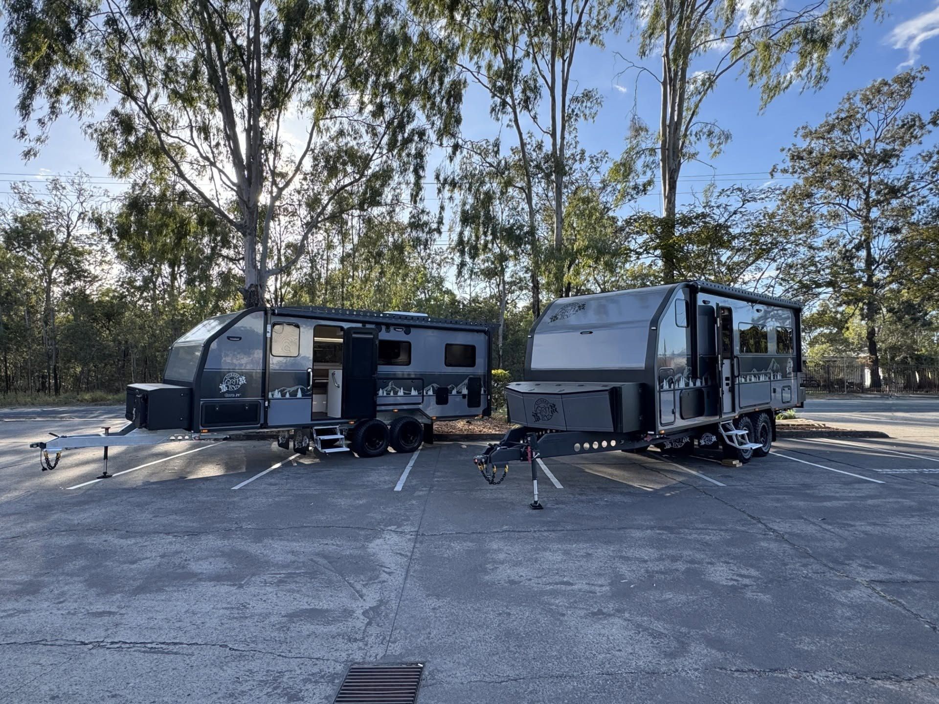 Two finished vans outside the factory