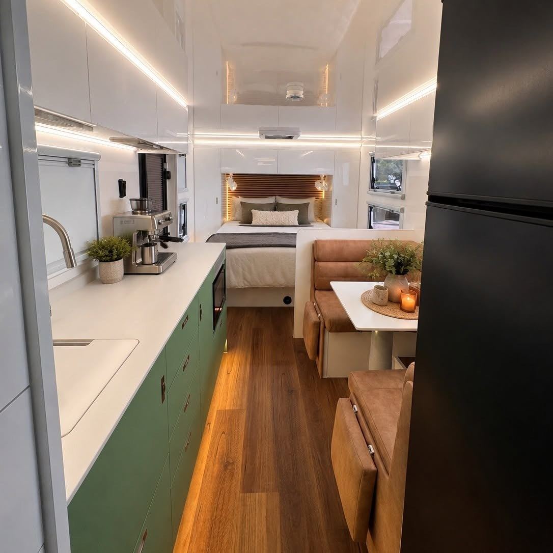 Sage-green kitchen looking through to the bedroom