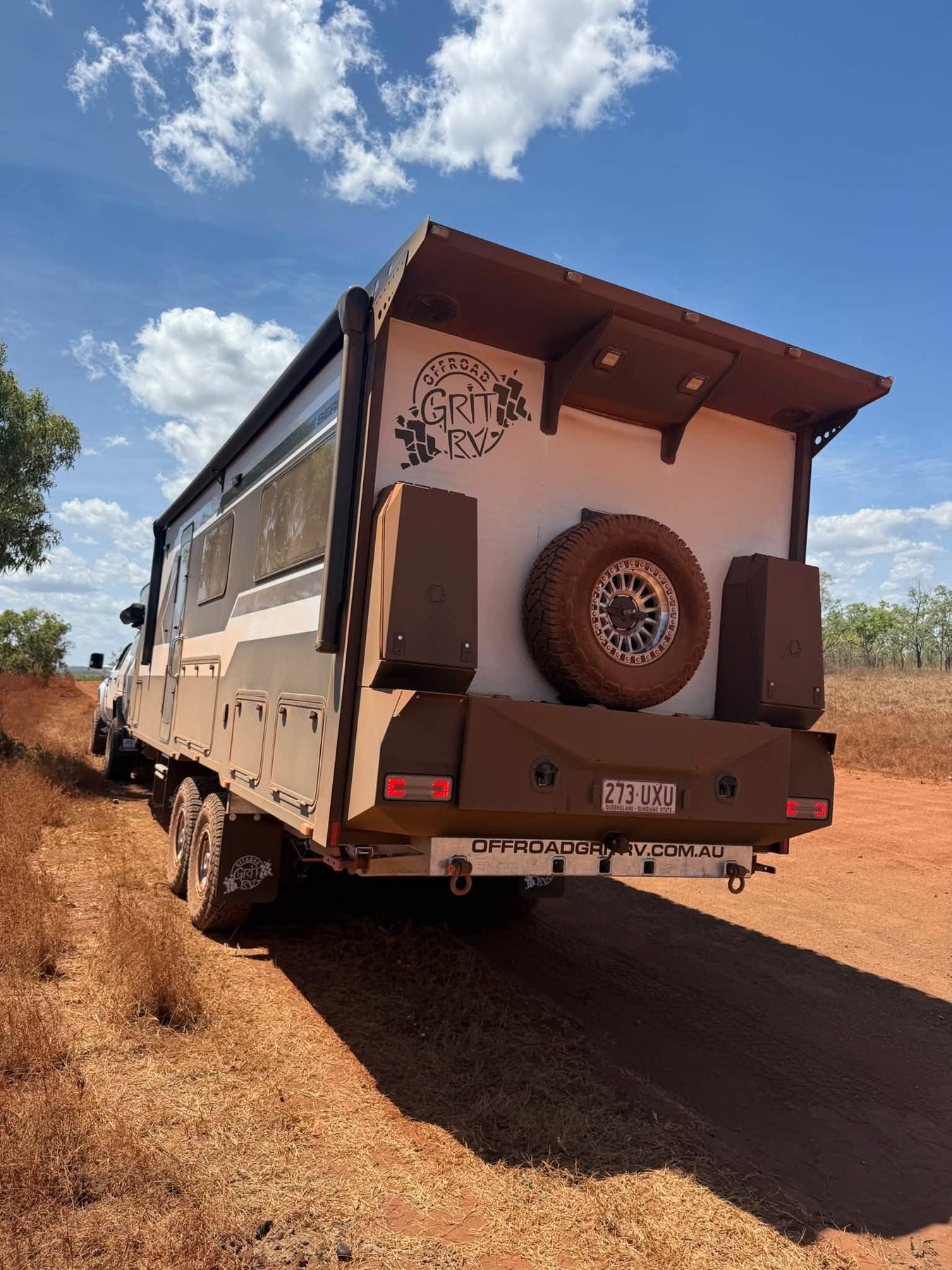 The rear of ADU's van, covered in red dust