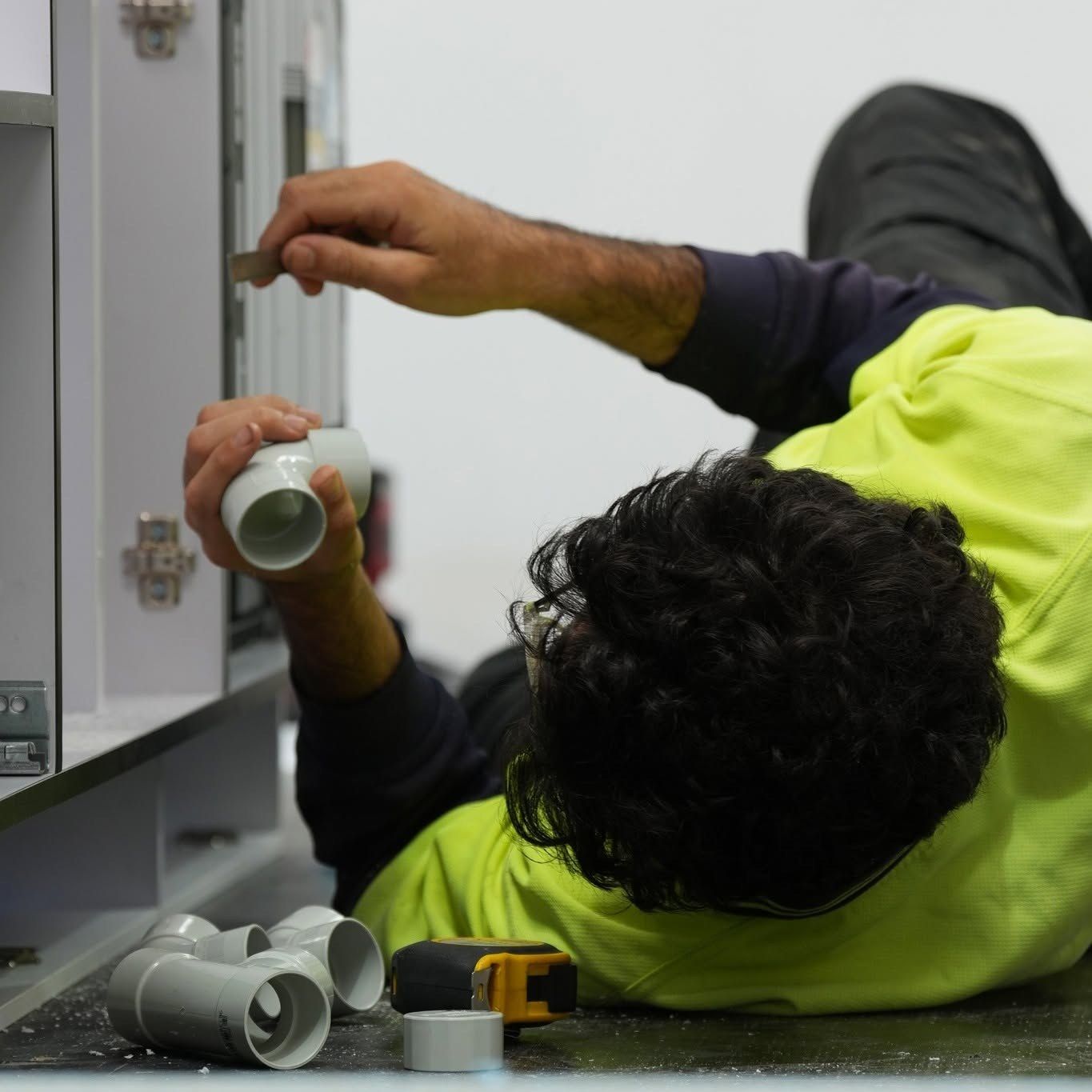 Plumbing under the cabinetry