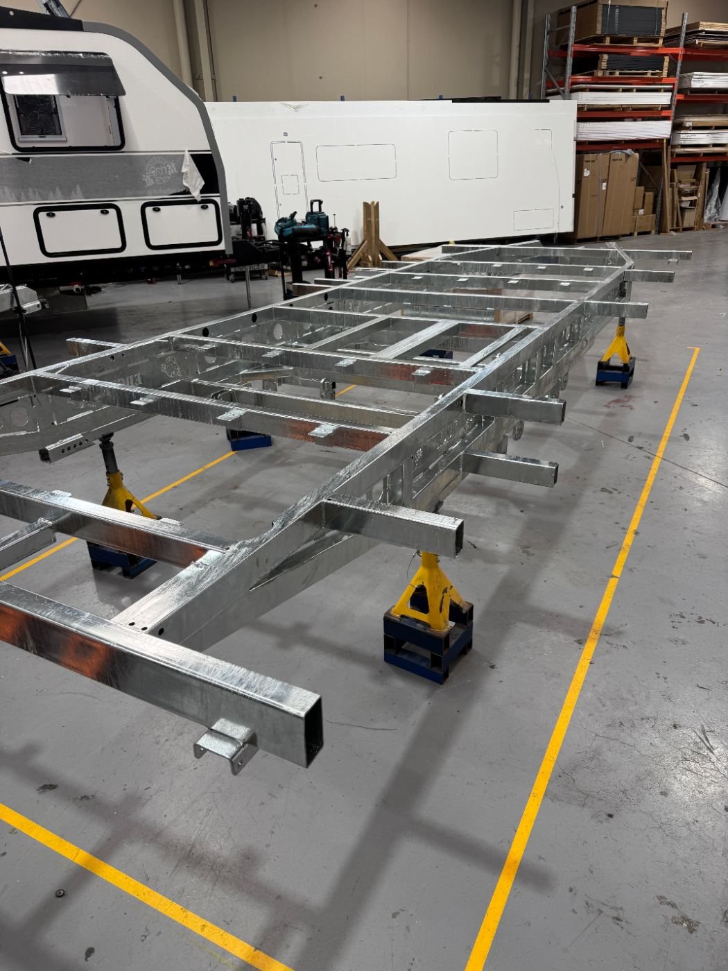 A truss chassis on stands on the factory floor
