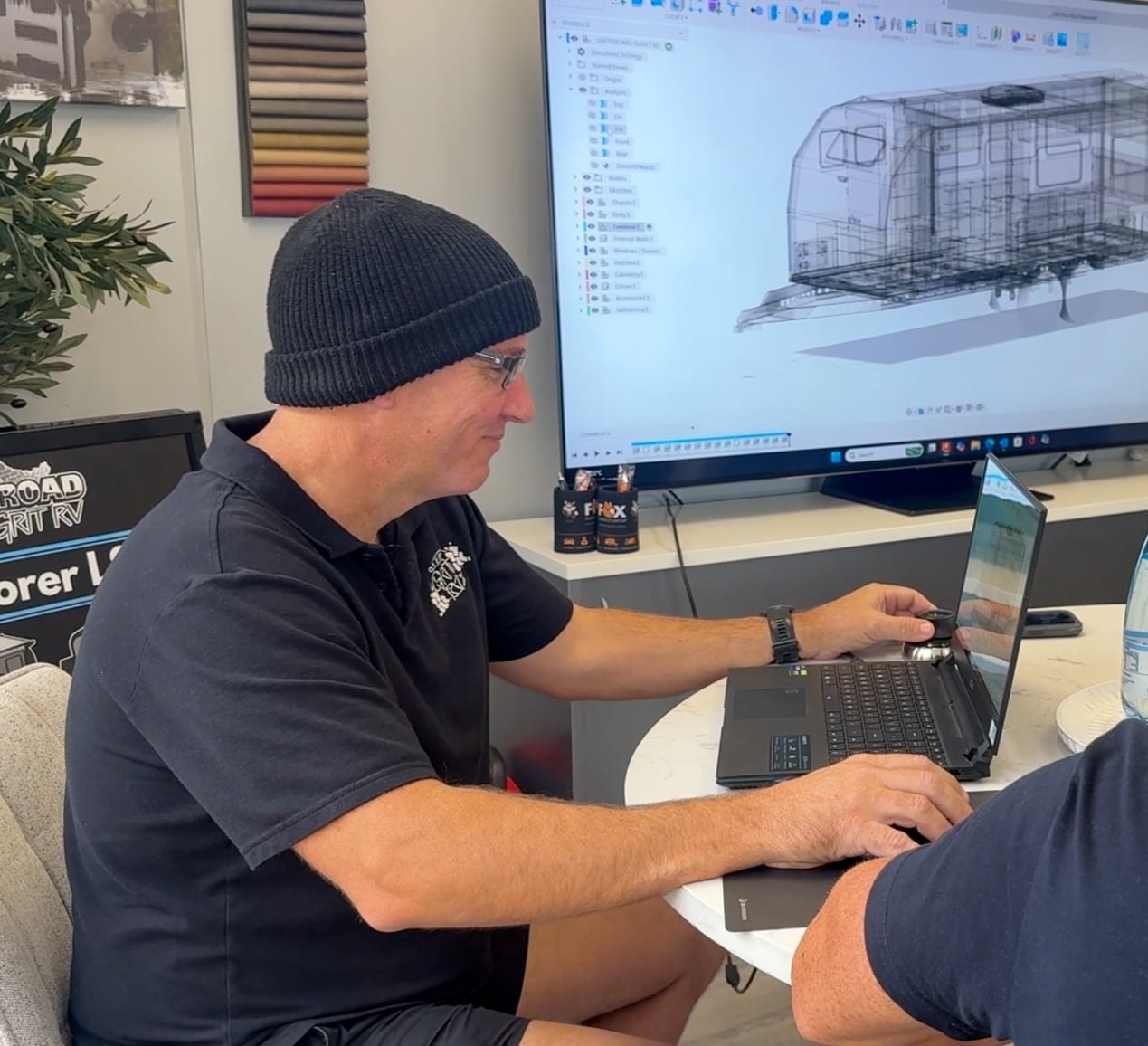 Mark at the design screen, drawing up a customer's van