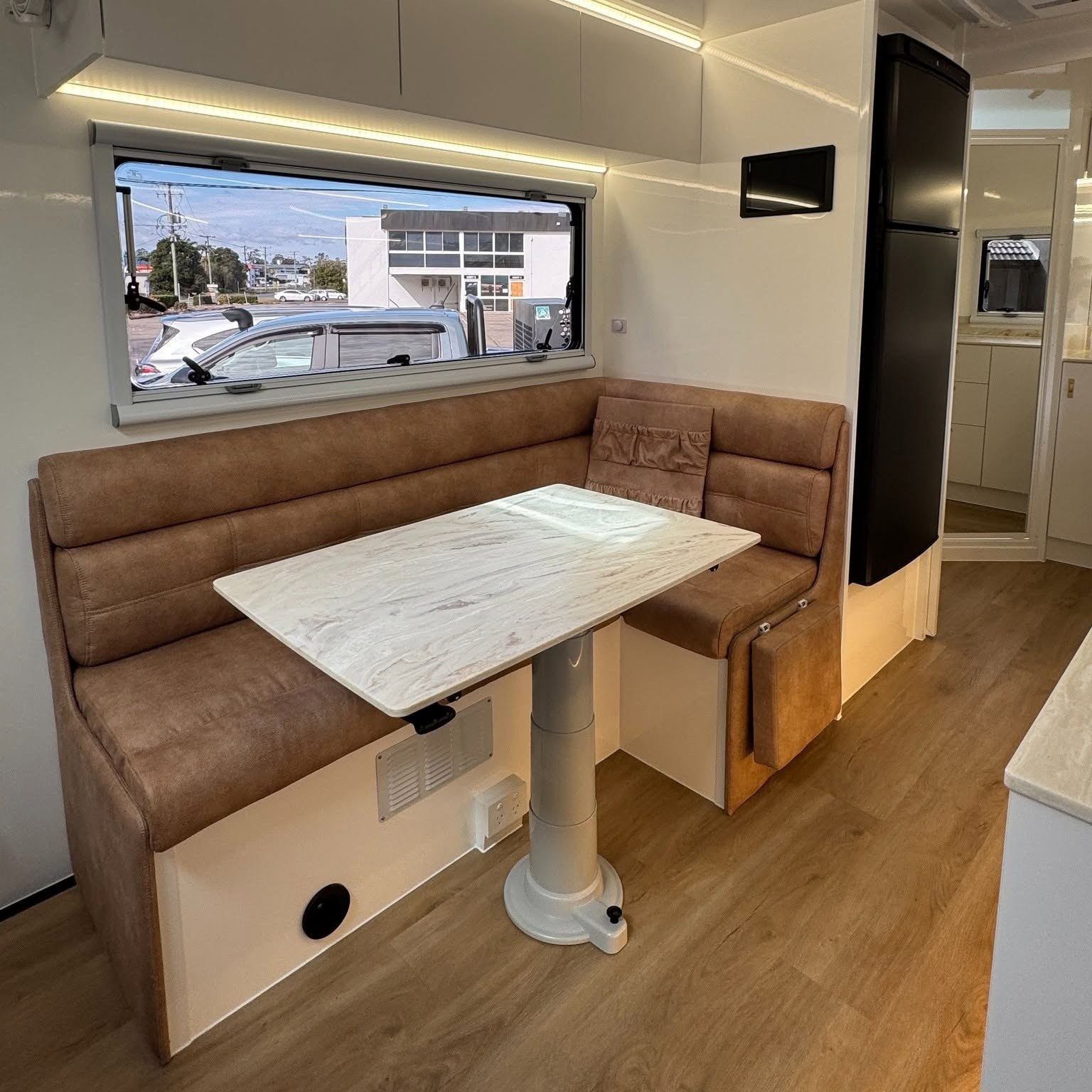 Tan leather U-shaped dinette