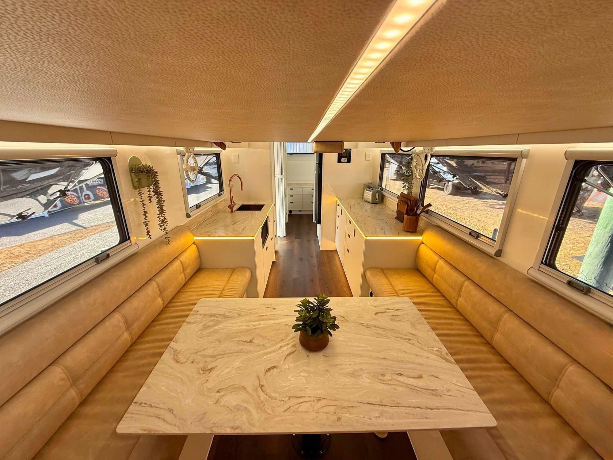 Inside a custom Offroad Grit RV, looking through the lounge