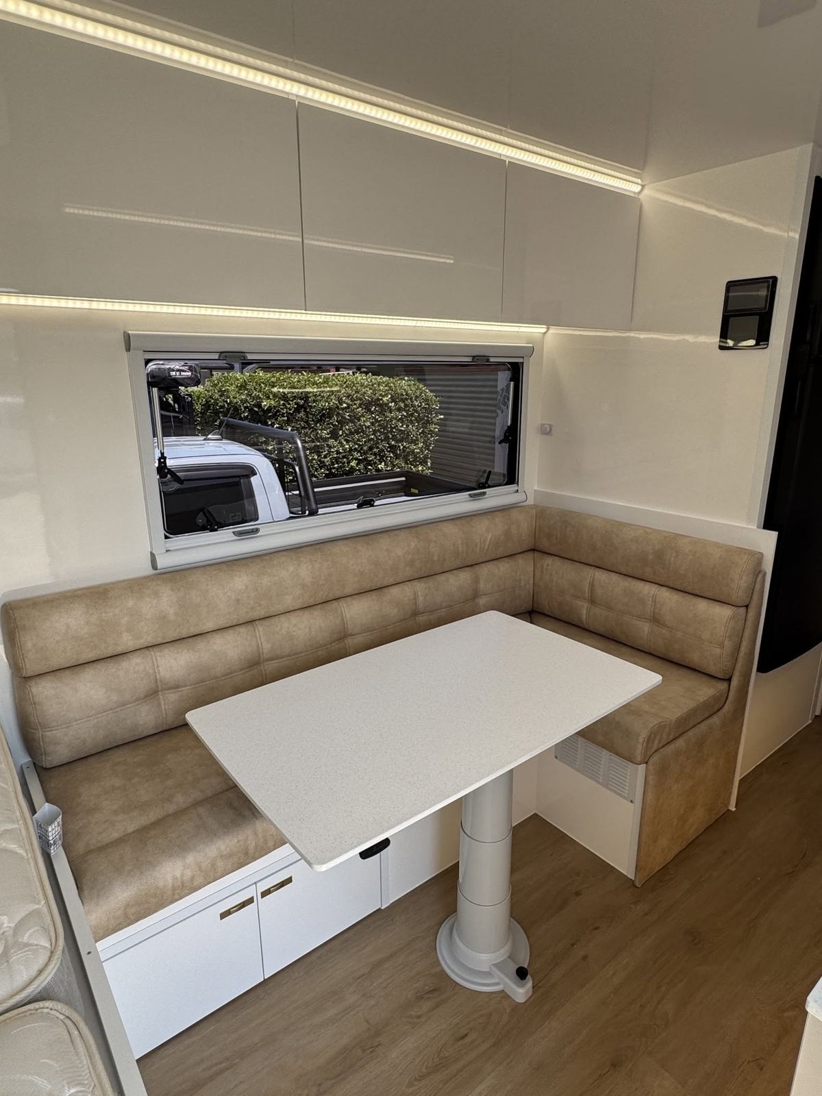 Tan U-shaped dinette
