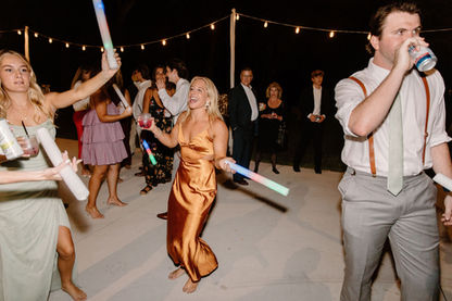 Wedding guests dancing at evening reception. Photo by Brittany Lauren