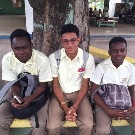 A group of boys sitting on a bench