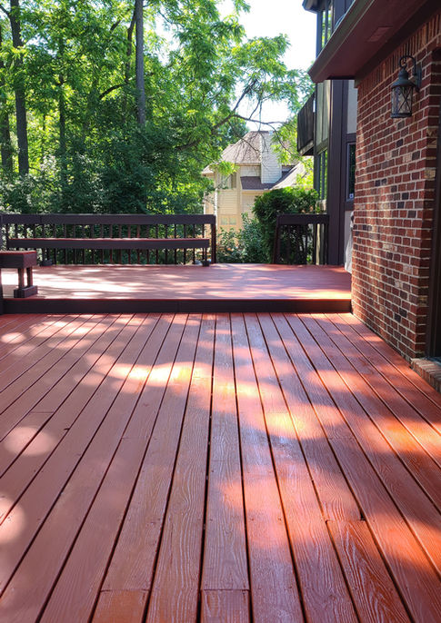 Custom wood build deck with built in benches and vibrant stain