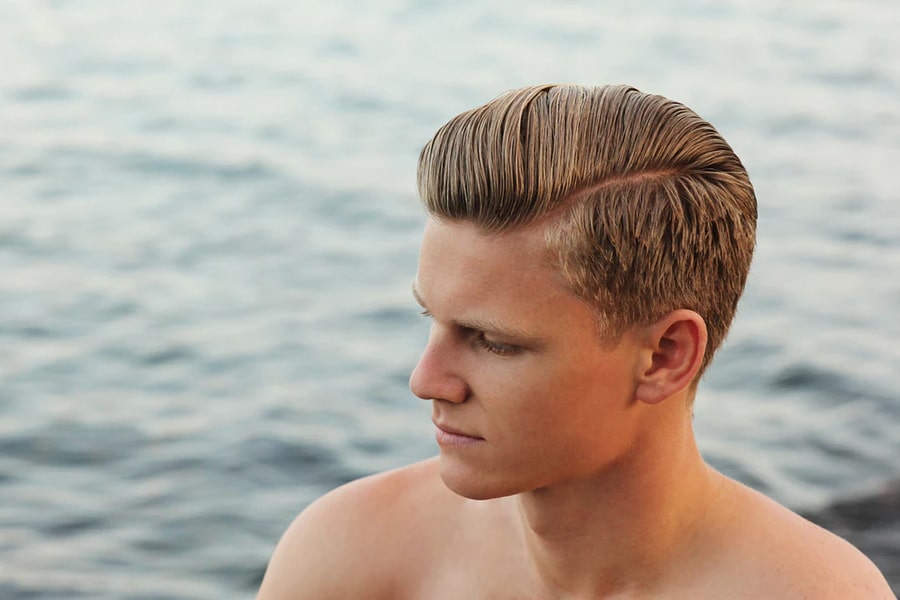 Man with short haircut comb over