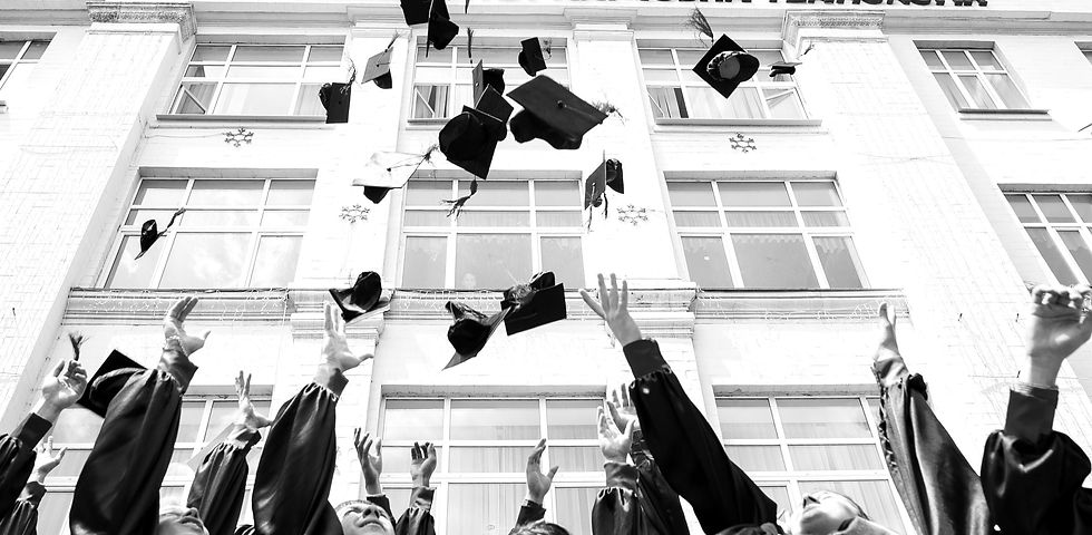 group of fresh graduates students throwing their academic hat in the air_edited.jpg