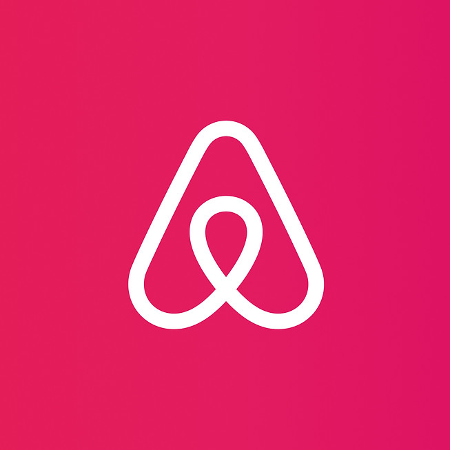 Airbnb_Logo_Over_Gradient.jpg