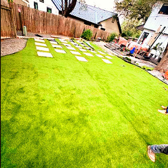Artificial turf installation gray gravel pavers walk stones