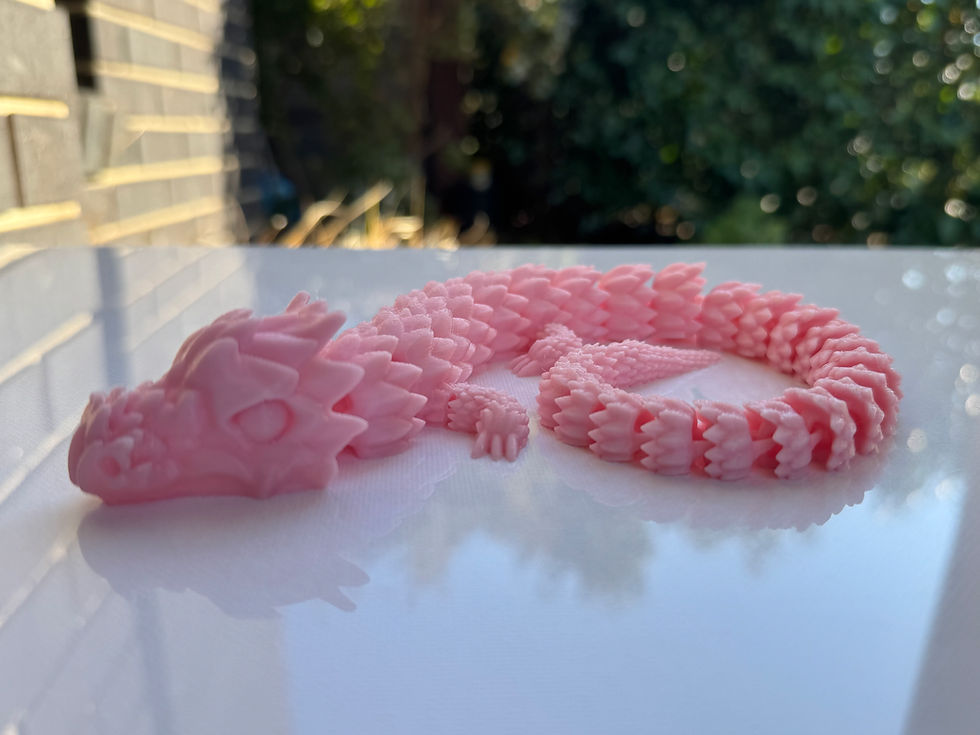 Pink segmented dragon figurine