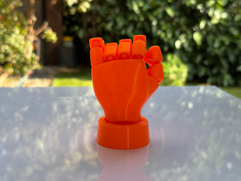 Thumbnail: Orange 3D-printed hand figurine