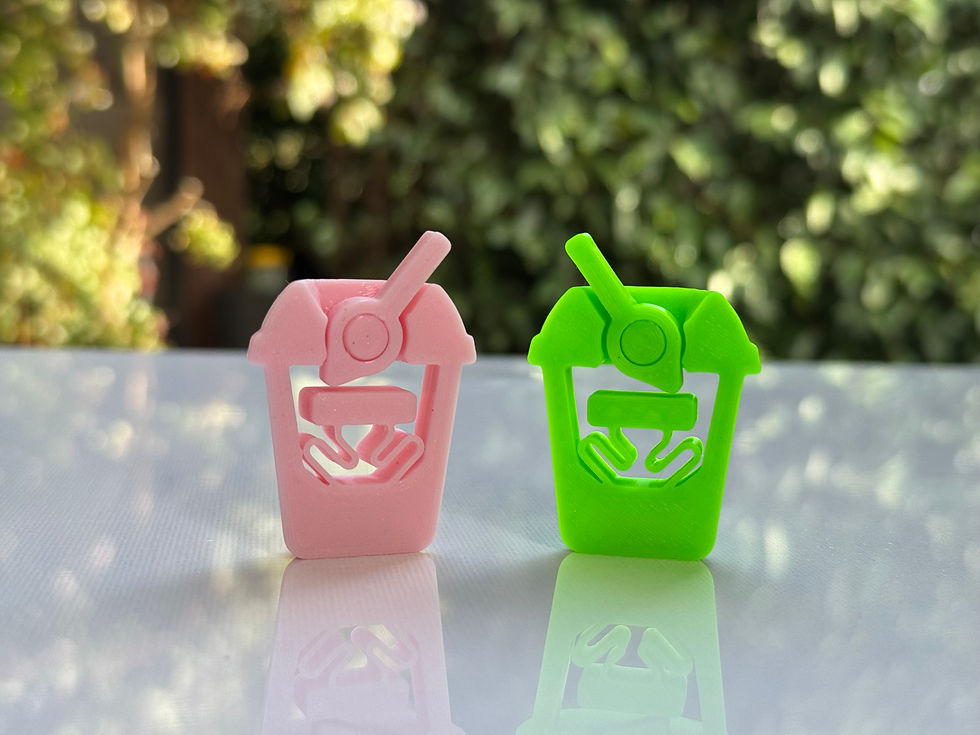 Pink and green boba tea clickers