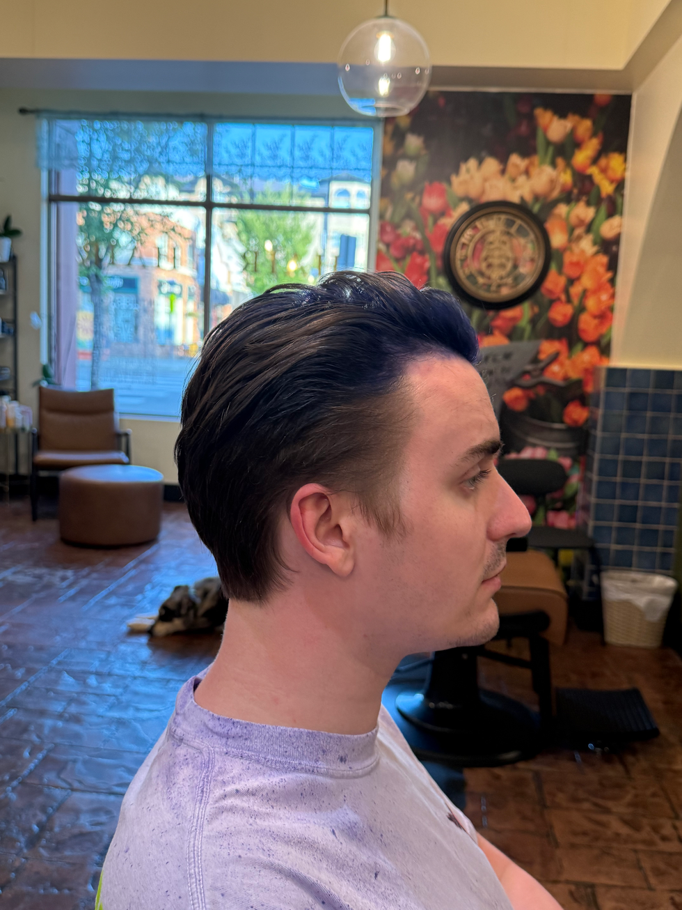 Right Side view of men's slicked-back haircut with blue ghost colour at Lawt Hair Salon, St. Albert