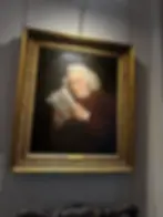 Painting of a man reading a newspaper