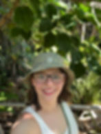 Selfie of Annie under some leaves and branches