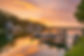 sunrise on waterfront property in a populated area with boat docks.jpg