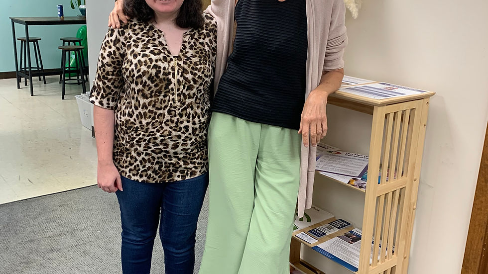 Girl Morgan standing next to Bette Ann Woman posing with smiles arm in arm.