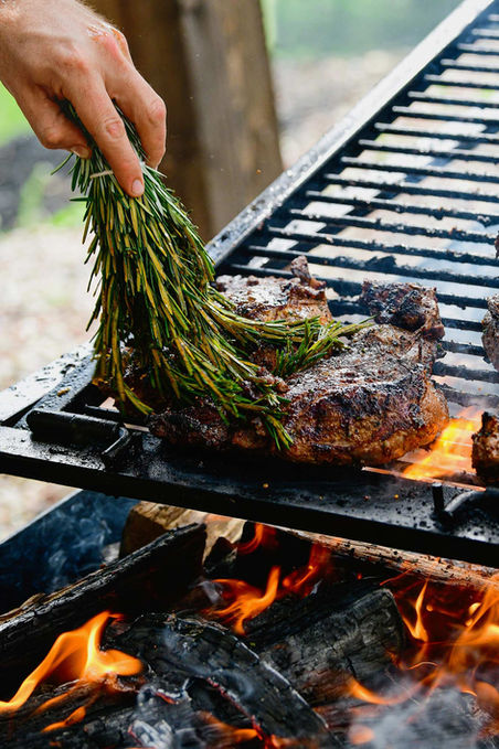 Rosemary rubbed steaks on fire