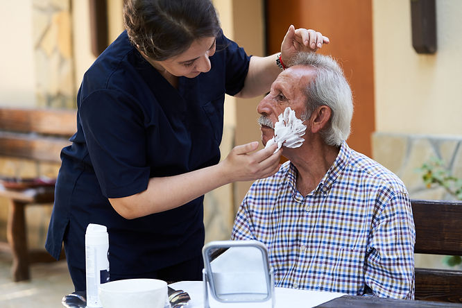 Professional helpful caregiver at nursin
