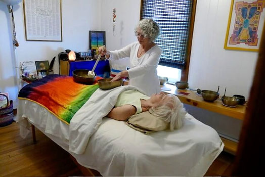 Energy healing practitioner in a session.