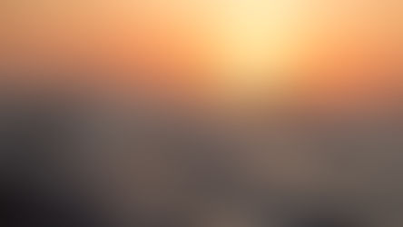 Sunset over ocean waves, sky glows orange and pink. Calm, serene atmosphere, no text.