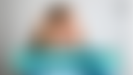 Woman listening to sound therapy for mental health with headphones, feeling relaxed and calm