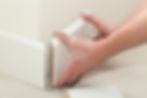 Carpenter fitting skirting boards