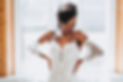 Bride Standing In Front of Mirror