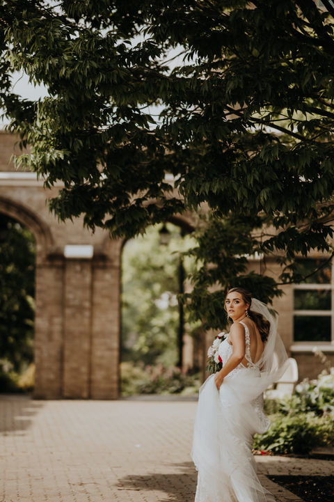 Bride walking and looking back at camera