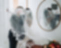 Bride and Groom Kissing in Front of Mirror