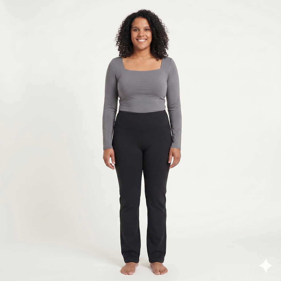 Front view of curvy model wearing a grey square-neck tee and black straight-leg bamboo pants.