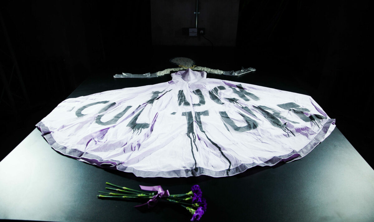 Projected imagery across a circular garment during the performance.