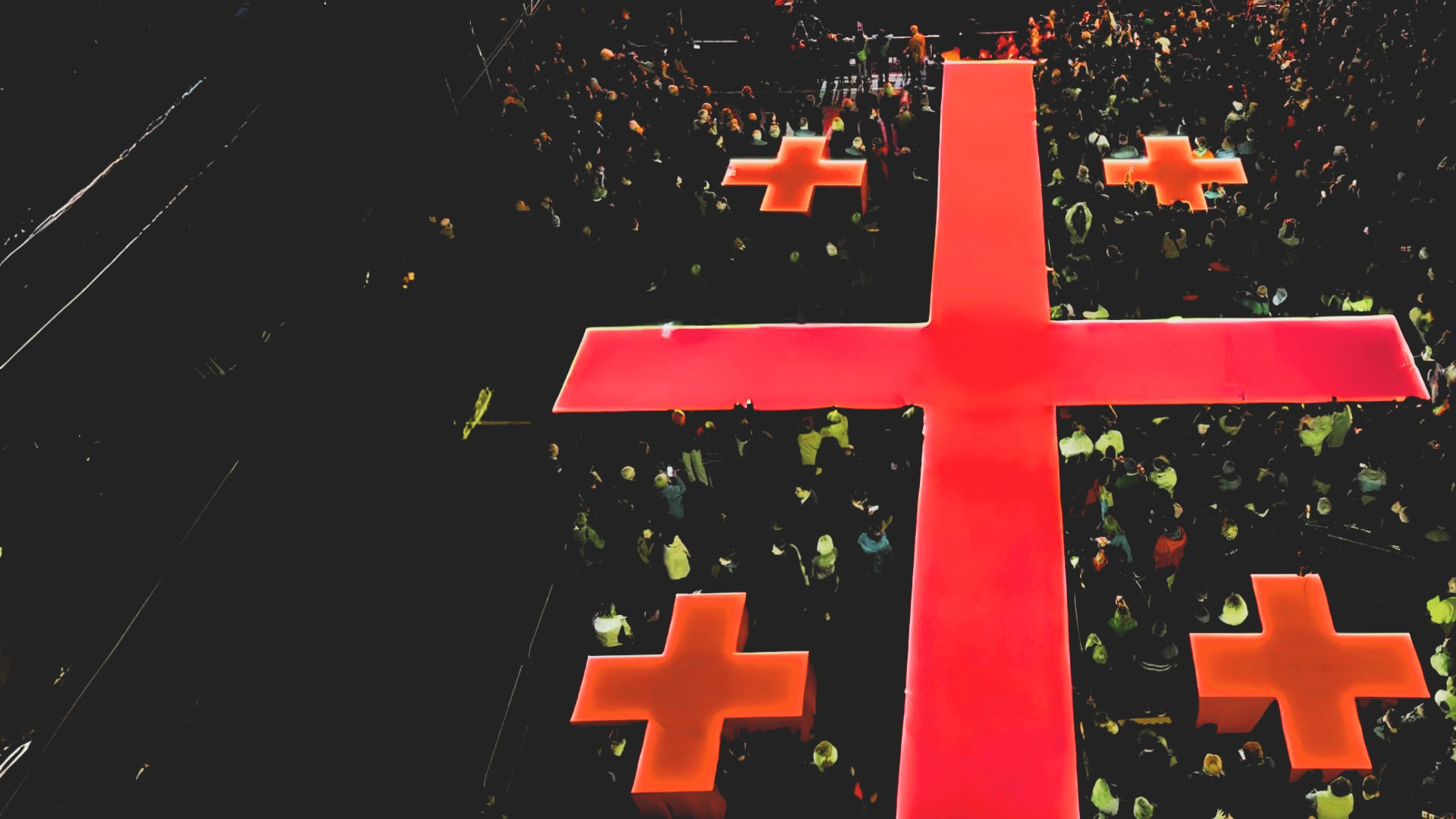 Aerial view of the illuminated Georgian flag and audience.