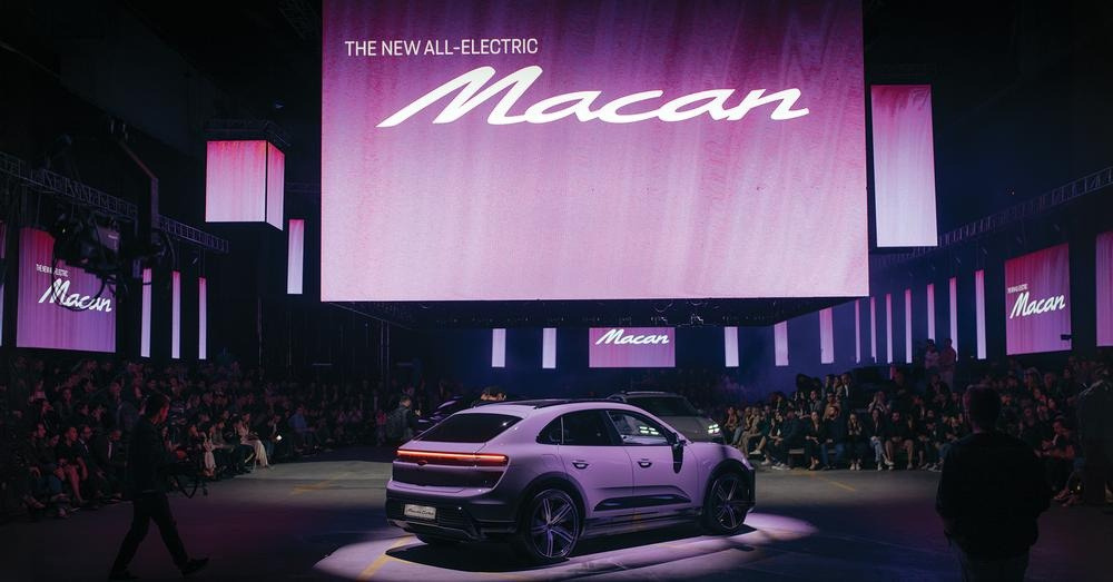 The all-electric Porsche Macan on its presentation stage.