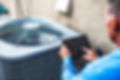 HVAC-contrator-diagnosing-air-conditioni