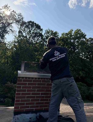 Professional chimney services technician doing a chimney sweep and inspection service to a chimney in NC