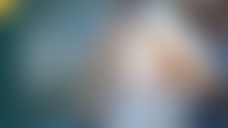 Close-up of diverse hands subtly interlocked, representing a strong, unified healthcare team working efficiently, with a softly blurred clinic background.