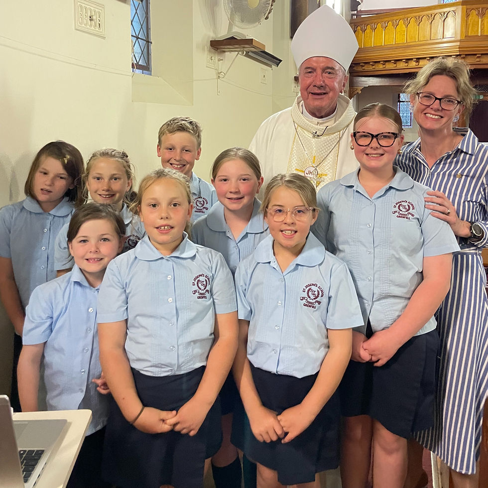 Member for Cootamundra Steph Cooke with Canberra-Goulburn Diocese Archbishop Christopher Prowse and St Joseph's Primary School students during the celebration in Grenfell on Saturday.