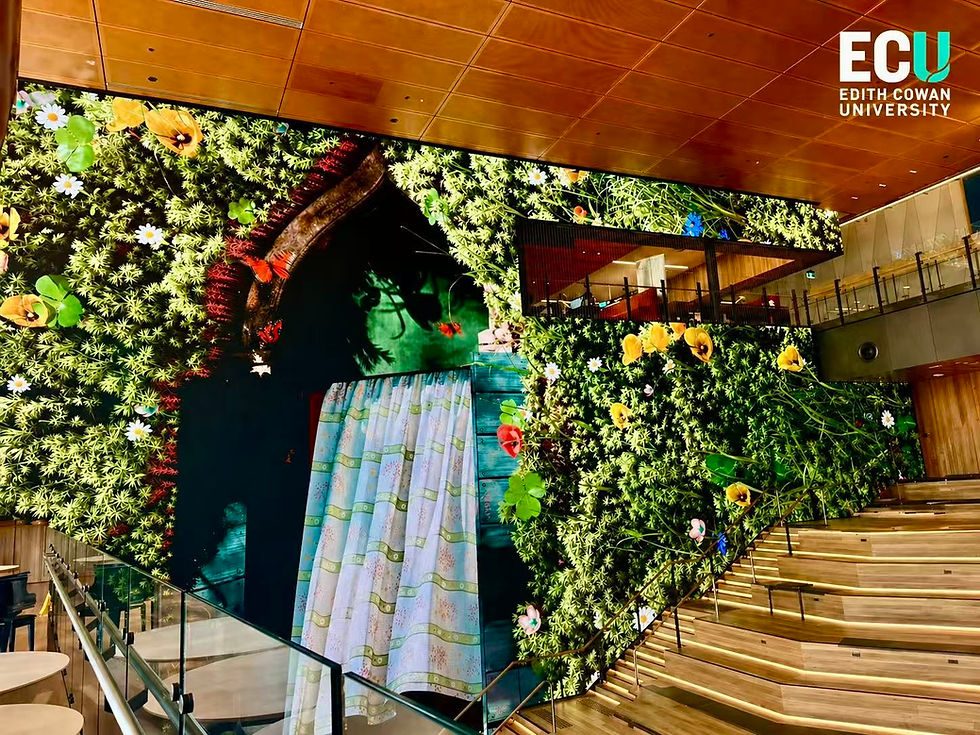 Large digital screen displaying green wall design inside ECU City Campus in Perth CBD