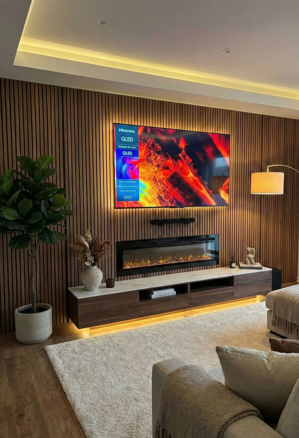 Modern dark wood vertical slat accent wall with linear electric fireplace. Acoustic wood panel installer for home theater design in Washougal WA, Camas, and Vancouver.