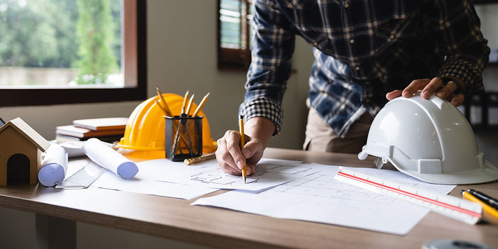 General contractor working on construction plans, representing B.C. Construction's commitment to quality and expertise in the St. Louis area.